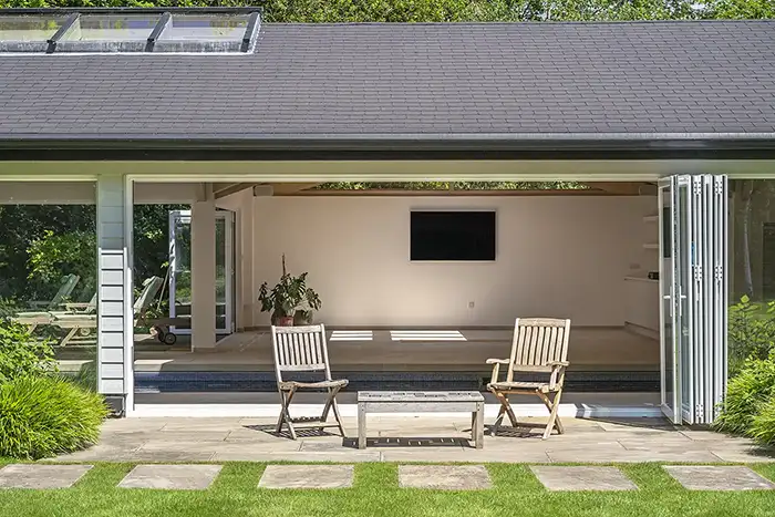 Pool heating heat pump External view of an indoor pool house with a heated pool