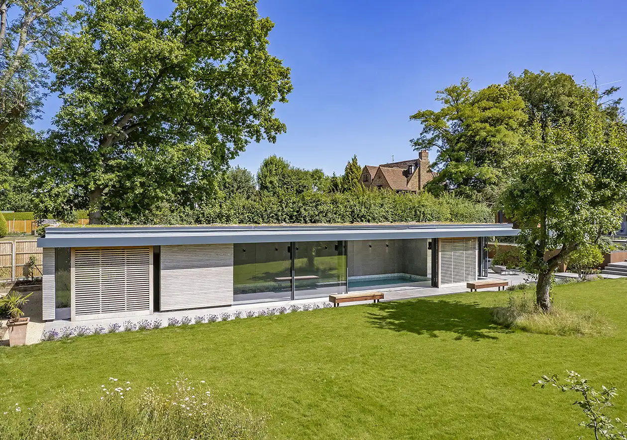 Indoor Swimming Pool Trends 2025 External view of an indoor pool house