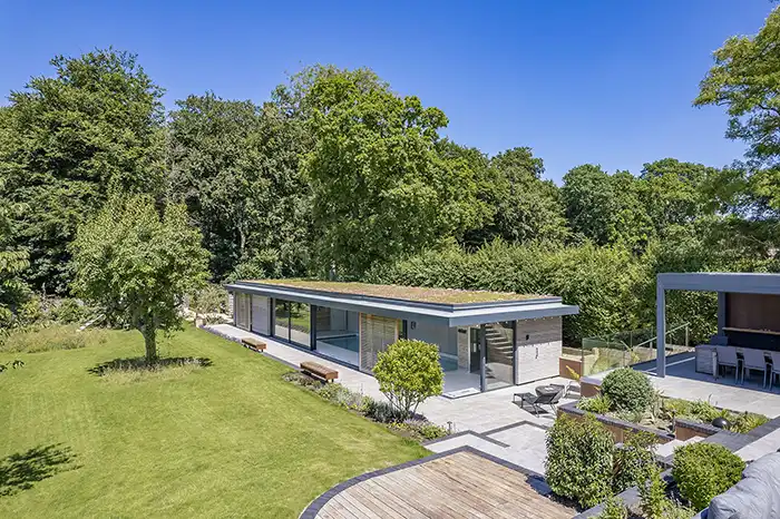 view of a pool house in a garden