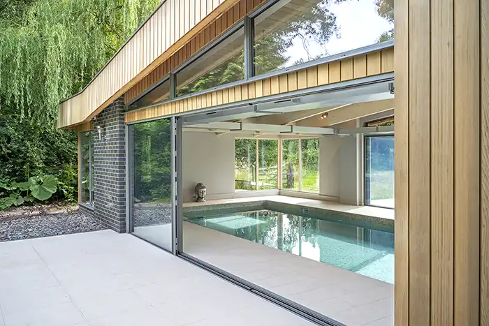 looking into a pool house from the outside